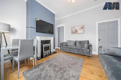 a living room with a couch and a table at Carlisle 3Bed Sleeps 6 in Carlisle