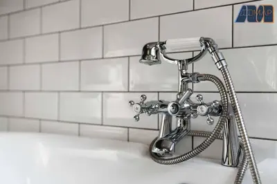 a shower head sitting on top of a bath tub at Carlisle 3Bed Sleeps 6 in Carlisle