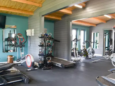 a gym with several treadmills and cardio machines at John Collingwood Bruce Suite - Uk43558 in Bowness-on-Solway