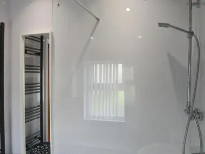 a bathroom with a shower and a window at John Collingwood Bruce Suite - Uk43558 in Bowness-on-Solway