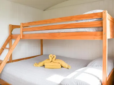 a stuffed animal laying on top of a bunk bed at Ryan's Shepherd Hut - Uk43565 in Bowness-on-Solway