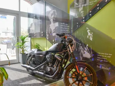 a motorcycle parked in a room with a wall at Jamie's Shepherds Hut - Uk43566 in Bowness-on-Solway