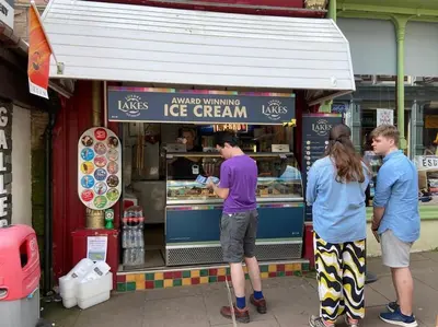 three people standing in front of a ice cream shop at Stanleys Sanctuary, Lake District in Plumbland