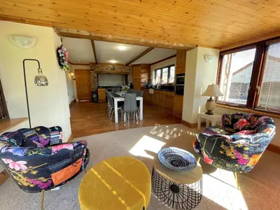 a living room with two chairs and a table at Beautiful 5BR House near Gretna Green with Garden - Pass the Keys in Kirkpatrick Durham