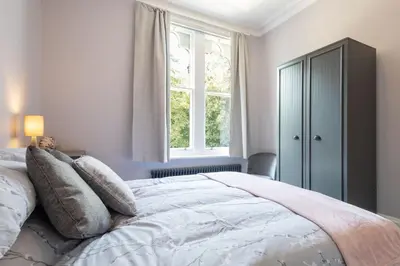 a bedroom with a large bed with a window at Host & Stay - Chatsworth Townhouse I in Carlisle