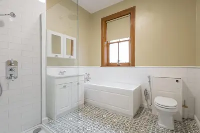 a bathroom with a tub and a toilet and a sink at Host & Stay - Chatsworth Townhouse II in Carlisle