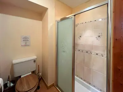 a bathroom with a shower and a toilet at Kirkdale in Kirkton