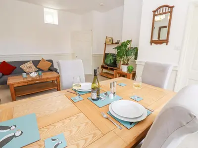 a dining room with a table with plates on it at John Duftons Barn in Cockermouth