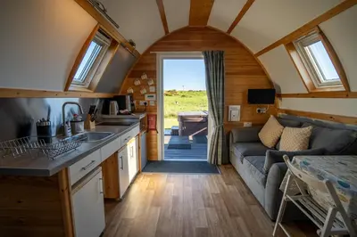 a kitchen and living room in a tiny house at Wigtown by Wigwam Holidays in Newton Stewart