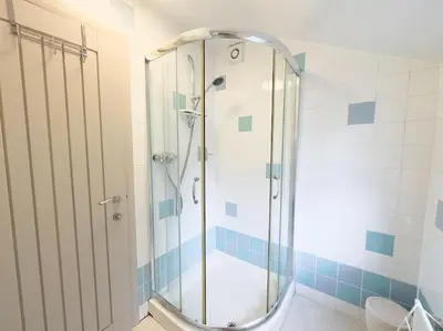 a shower with a glass door in a bathroom at RIDGEMOUNT APT - Great base for walking and cycling in Keswick, Lake District National Park in Keswick