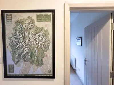 a picture of a map on a wall in a hallway at RIDGEMOUNT APT - Great base for walking and cycling in Keswick, Lake District National Park in Keswick