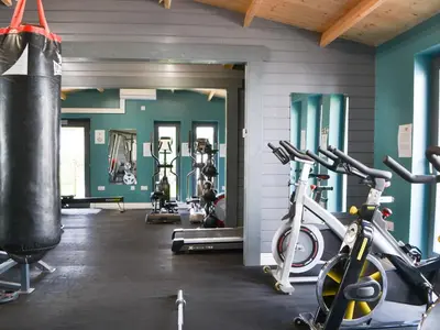 a gym with two exercise bikes and a punching bag at Tiberius Claudius Augustus Suite - Uk43559 in Bowness-on-Solway