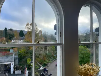 an arched window with a view of a street at The Tops in Keswick