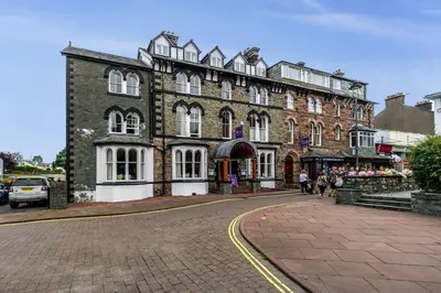 a large brick building on a city street at The Tops in Keswick