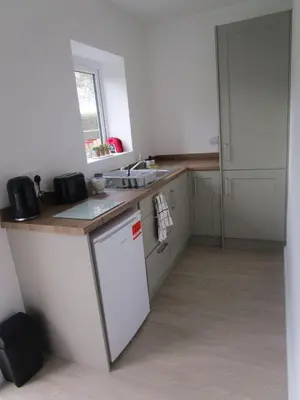 a kitchen with a sink and a counter top at Oak End Stay in Carlisle