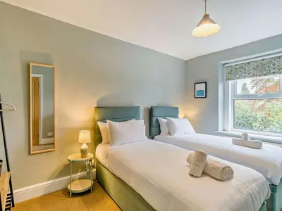 a bedroom with two beds and a window at 4 Bed in Keswick oc-95739 in Bassenthwaite