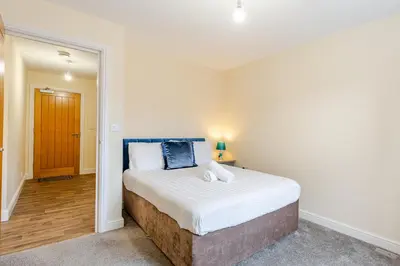 a bedroom with a large bed in a room at John Dalton House in Cockermouth