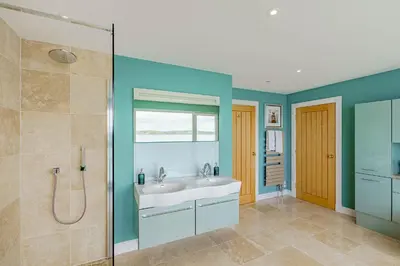 a bathroom with a sink and a shower at Balcary Tower in Castle Douglas