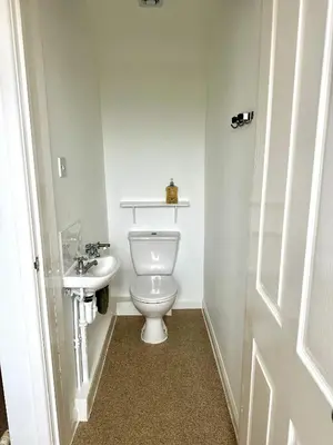 a bathroom with a toilet and a sink at CosyHouse2 Private Parking Base for Lake District and Sellafield in Cleator Moor