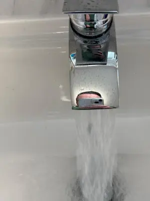 a stream of water coming out of a faucet at No 10, Ayr, 130m2, New Decor December 2024, All new entire 3 bedroom garden house in Ayr