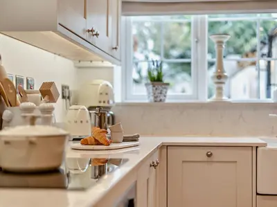 a kitchen counter with a plate of food on it at 2 Bed in Cockermouth 95716 in Broughton Moor