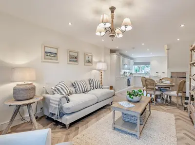 a living room with a couch and a table at 2 Bed in Cockermouth 95716 in Broughton Moor