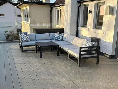 a bench and a table on a patio at Whitegates in Rockcliffe