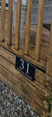 a wooden bench with the number on it at Ramblers Retreat in Cockermouth