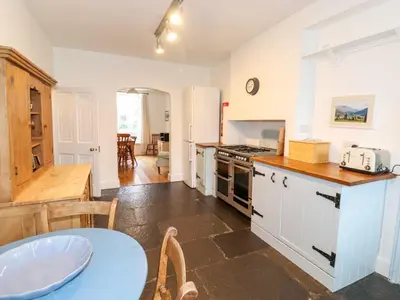 a kitchen with a table and a counter top at Middletown in Keswick