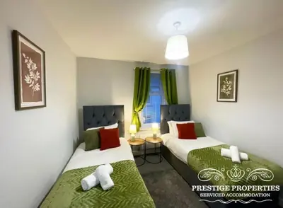 a room with two beds and a window at Jackson St by Prestige Properties SA in Siddick