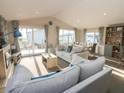 a living room with two couches and a table at Brocklebank Lodge, 35 in Carlisle