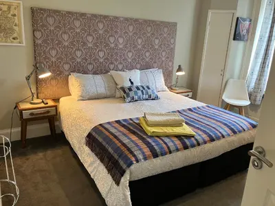 a bedroom with a bed with two towels on it at Apartment 28 in Ayr