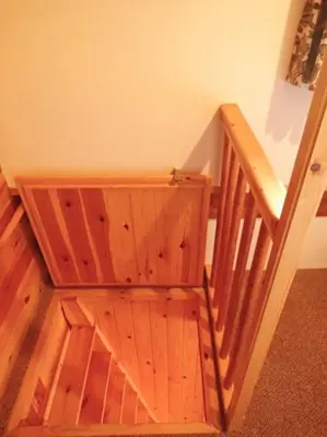 a wooden staircase in a room with wooden walls at The Dairy - Patterdale Hall in Penrith