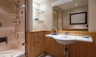 a bathroom with a sink and a shower at Underscar - Stonethwaite in Keswick