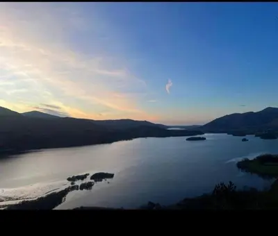 a view of a large body of water at sunset at Maiden Moor in Borrowdale Valley