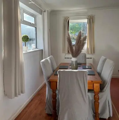 a dining room with a wooden table and chairs at Maiden Moor in Borrowdale Valley