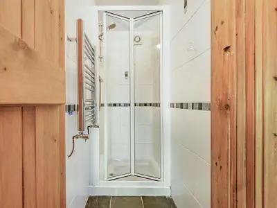 a shower in a bathroom with a glass door at 3 Bed in Keswick oc-sz080 in Braithwaite