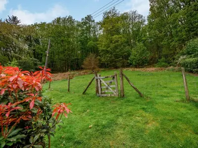 a fence with a gate in a field at 3 Bed in Keswick oc-sz080 in Braithwaite