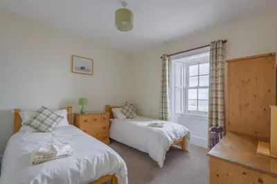 a bedroom with two beds and a window at 3 Bed in Drummore oc-p30213 in Drummore