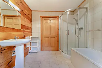 a bathroom with a sink and a shower and a tub at 3 Bed in Kippford oc-g30100 in Kippford