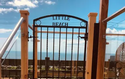 a gate with the words little beach behind it at Little Beach in Gatehouse of Fleet
