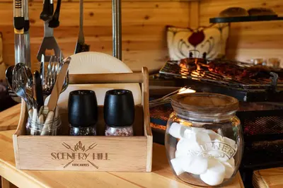a wooden box filled with utensils on a counter at Scenery Hill Hideaways The Coach House Charming Retreat with Jacuzzi and BBQ Hut Near the Lake District in Workington