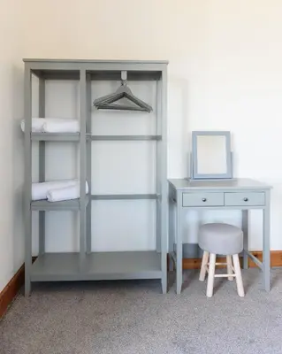 a desk and a table and a chair next to a desk at Shell Cottage in Whithorn