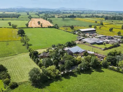 an aerial view of a house in a field at Cedrus Lodge in Penrith