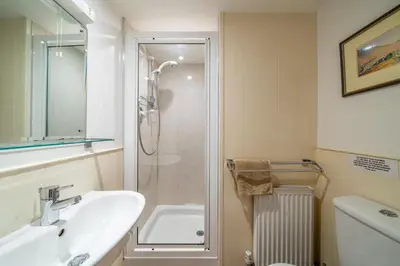 a bathroom with a sink and a shower at Ghyll Foot - At the foot of Place Fell, Ullswater in Patterdale