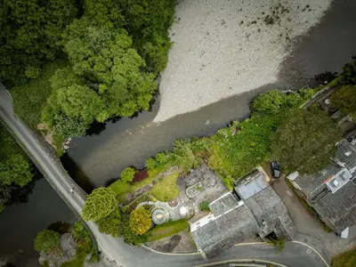 an overhead view of a yard with a house at Grange Bridge Cottage in Grange