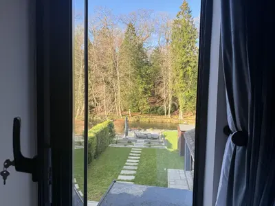 a view of a garden from a window at Greta House in Keswick