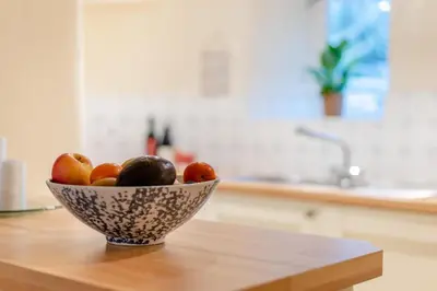 a bowl of fruit sitting on top of a table at 2 Bed in Greystoke oc-s30412 in Greystoke