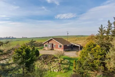 an aerial view of a small house in a field at Dunrod - Overlooking the bay in Kirkcudbright