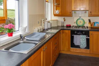 a kitchen with a sink and a counter top at No2 Chapelton Cottage in Kirkcudbright